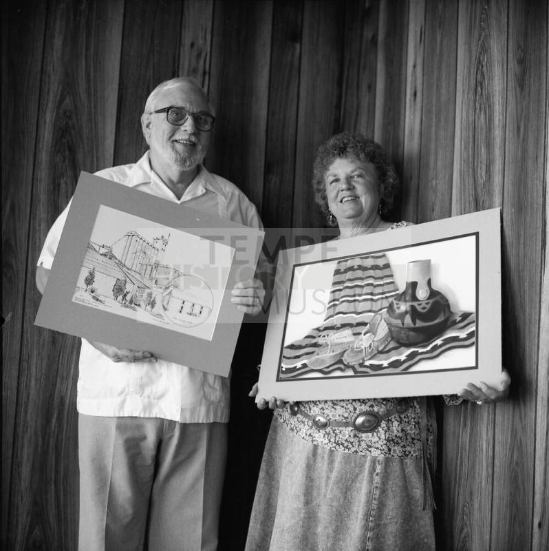 Richard Nearing showing his "Hayden Flour Mill' pen and ink, Jeanne Sweet with her pastel "The Green Moccasins"