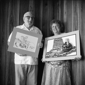 Richard Nearing showing his "Hayden Flour Mill' pen and ink, Jeanne Sweet with her pastel "The Green Moccasins"