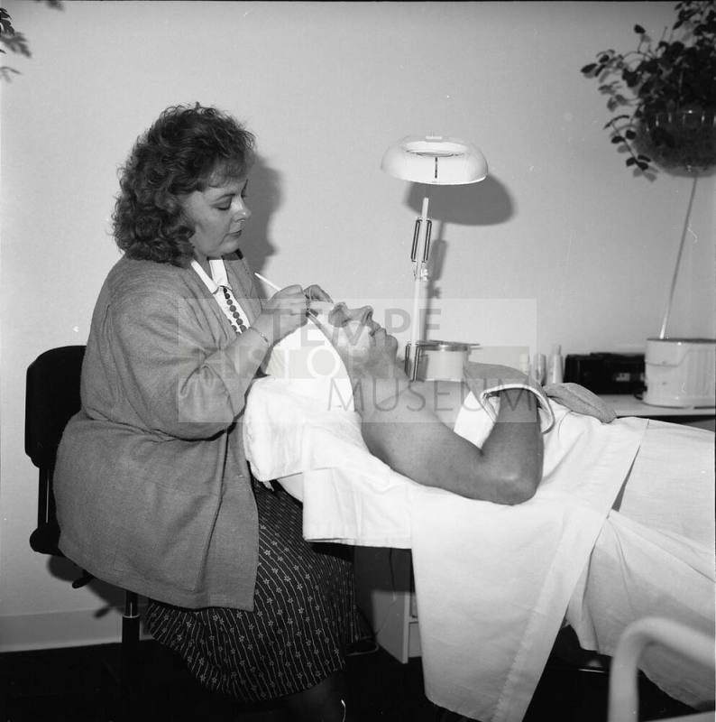 Opening of "Salon Enchanté" Blake Harris is recieving a 'European Facial' from Peggy Thomas, Salon director and owner