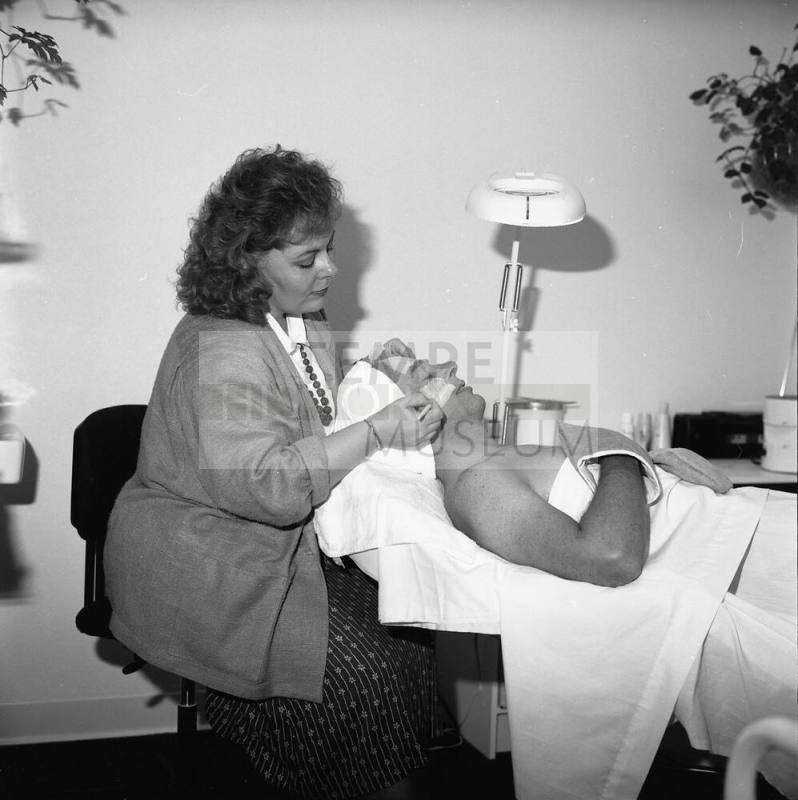 Opening of "Salon Enchanté" Blake Harris is recieving a 'European Facial' from Peggy Thomas, Salon director and owner