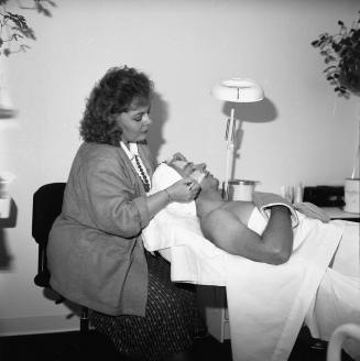 Opening of "Salon Enchanté" Blake Harris is recieving a 'European Facial' from Peggy Thomas, Salon director and owner