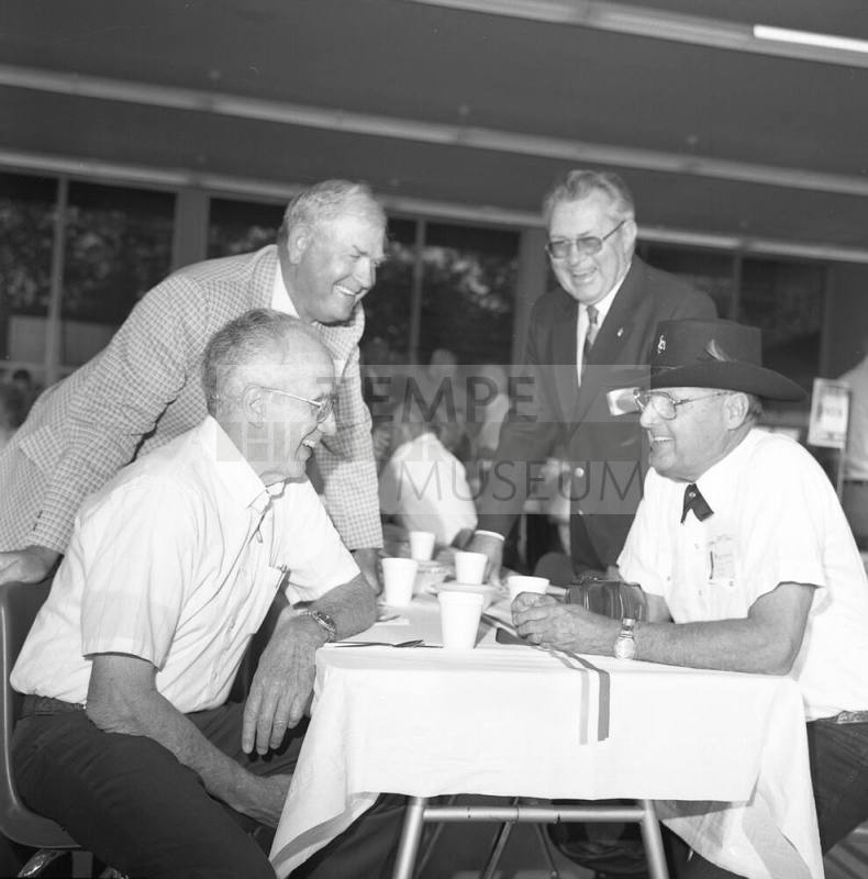 Tempe High Annual Reunion, for gentlemen gathered around a table talking