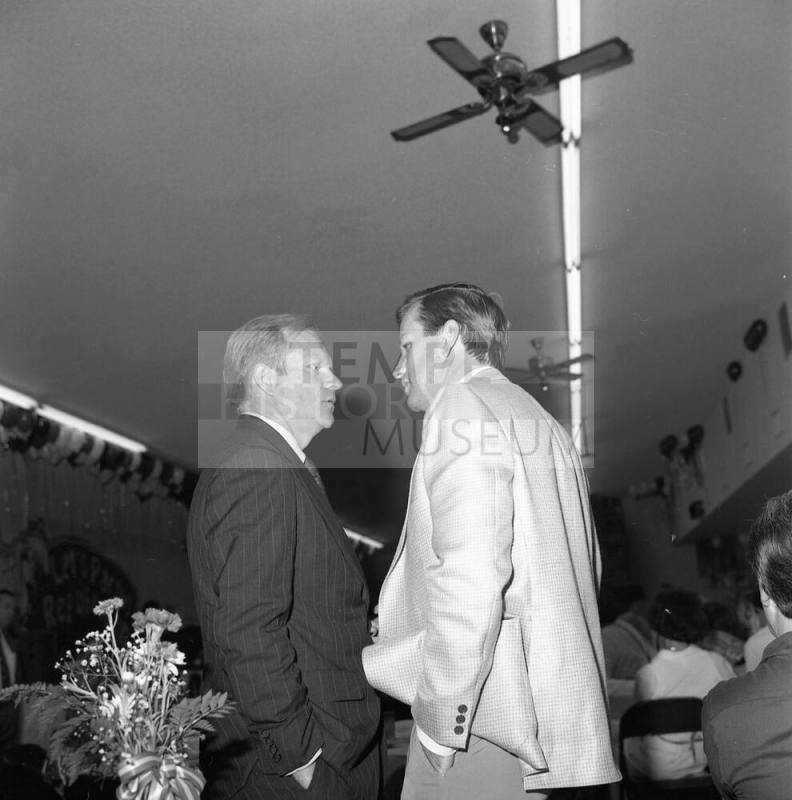 Two Unidentified Men at an Event
