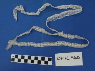 Two thin strips of lace cream colored