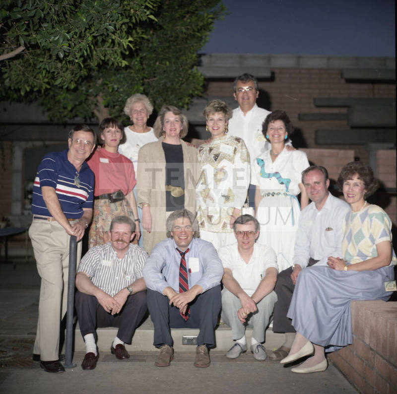 Group photo in backyard of Hackett House (back row has Dick Neuheisel and Marianne Mitchell)