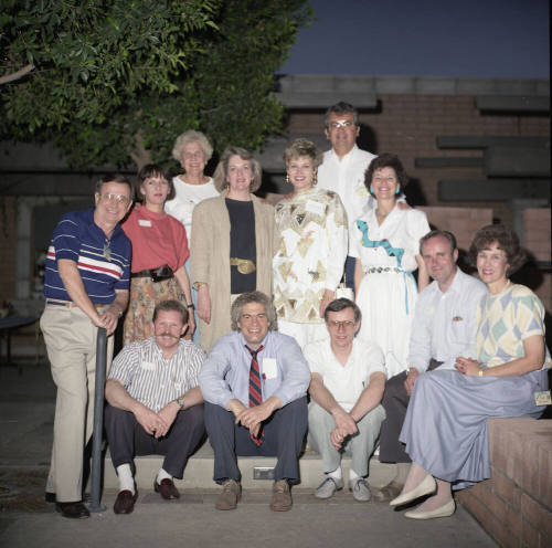Group photo in backyard of Hackett House (back row has Dick Neuheisel and Marianne Mitchell)
