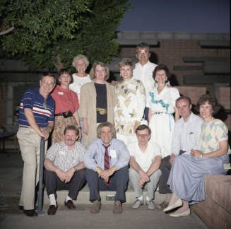Group photo in backyard of Hackett House (back row has Dick Neuheisel and Marianne Mitchell)