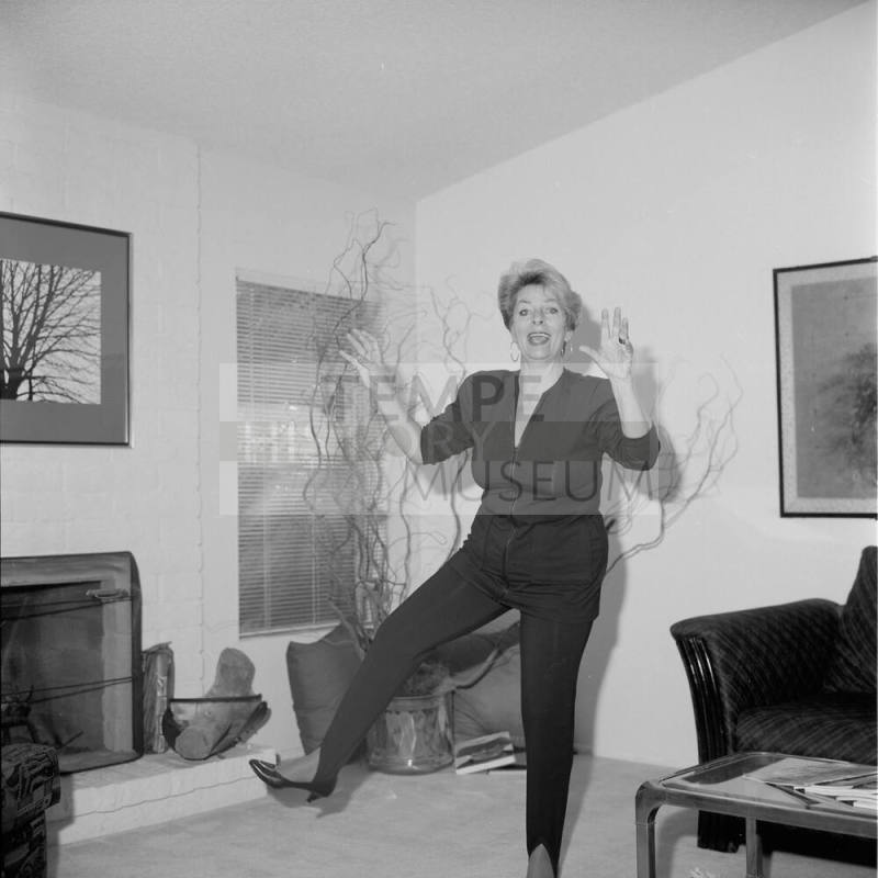 Middle Aged woman dancing in her home