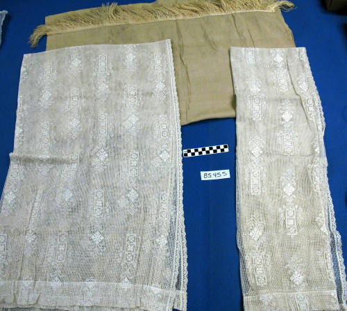 Two white lace blankets and a Tan Flat Sheet with Fringe