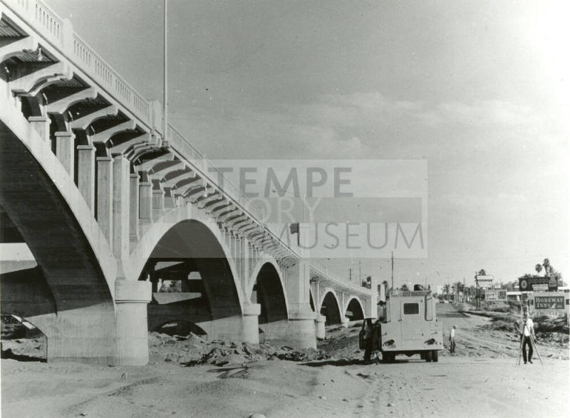Beside Mill Avenue Bridge looking North -surveying for road through river bottom