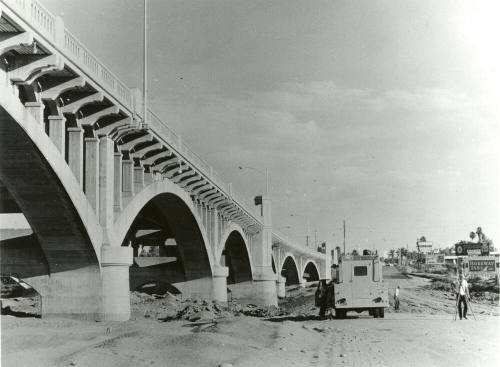 Beside Mill Avenue Bridge looking North -surveying for road through river bottom