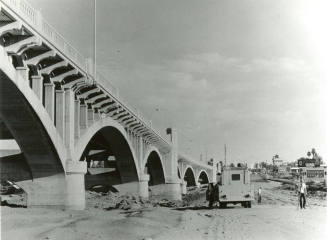 Beside Mill Avenue Bridge looking North -surveying for road through river bottom