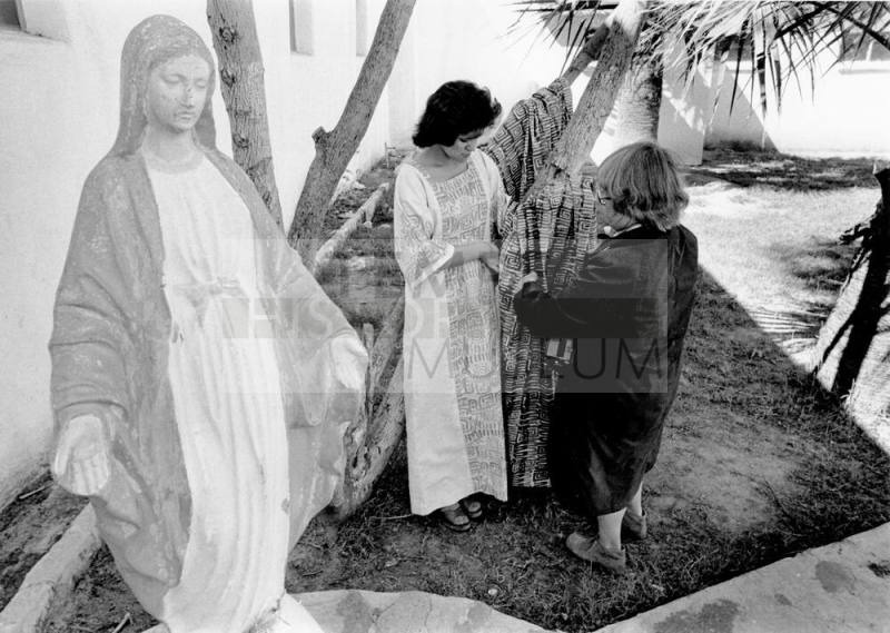 Jan Young sets up photo shoot at Catholic Church.
