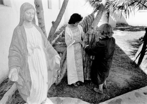 Jan Young sets up photo shoot at Catholic Church.