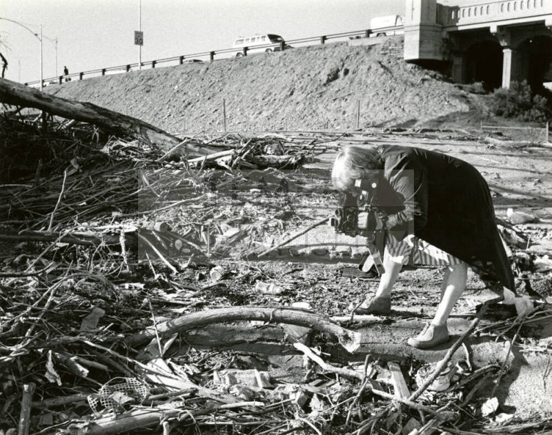 Jan Young photographs nature beside Mill Avenue Bridge, Tempe, Arizona.