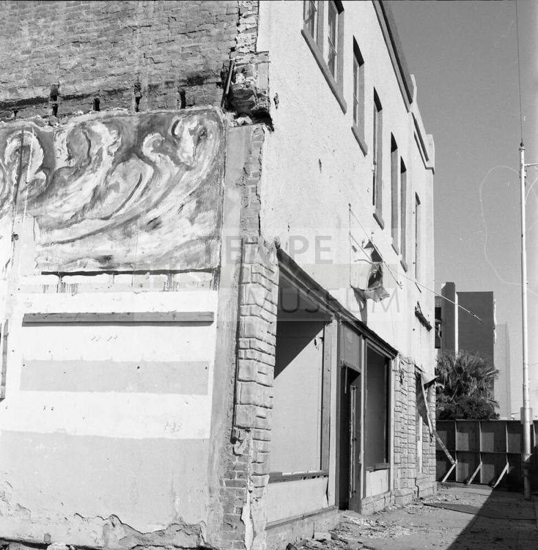 Partially demolished building, 4th Street and Mill Avenue