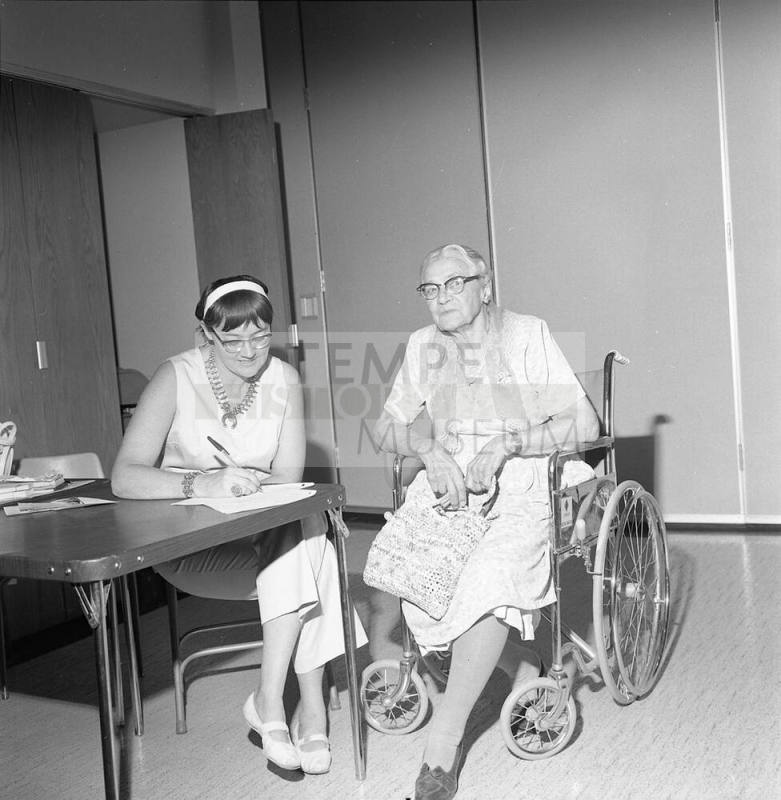 Two women, one in wheelchair
