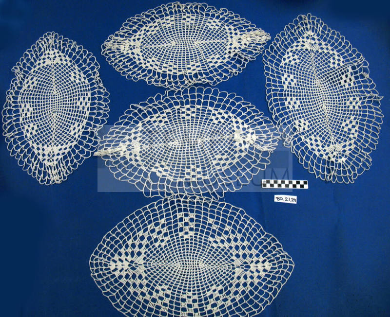 White cotton crocheted, oval open-work doily