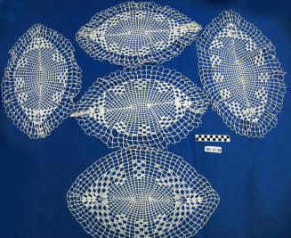 White cotton crocheted, oval open-work doily