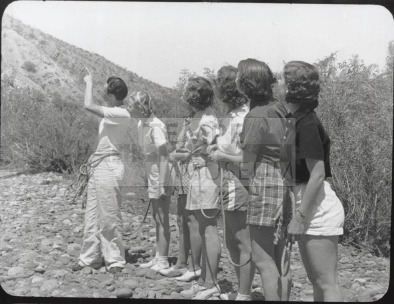 Black and white Photograph: group of coeds climbing Tempe Butte