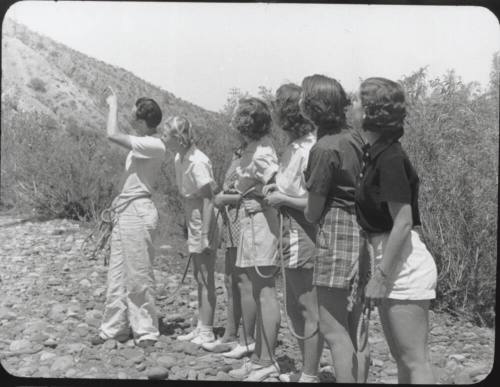 Black and white Photograph: group of coeds climbing Tempe Butte