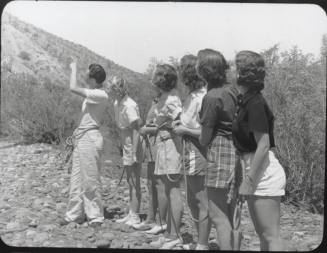 Black and white Photograph: group of coeds climbing Tempe Butte
