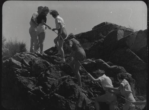 Black and white Photograph: group of coeds climbing Tempe Butte
