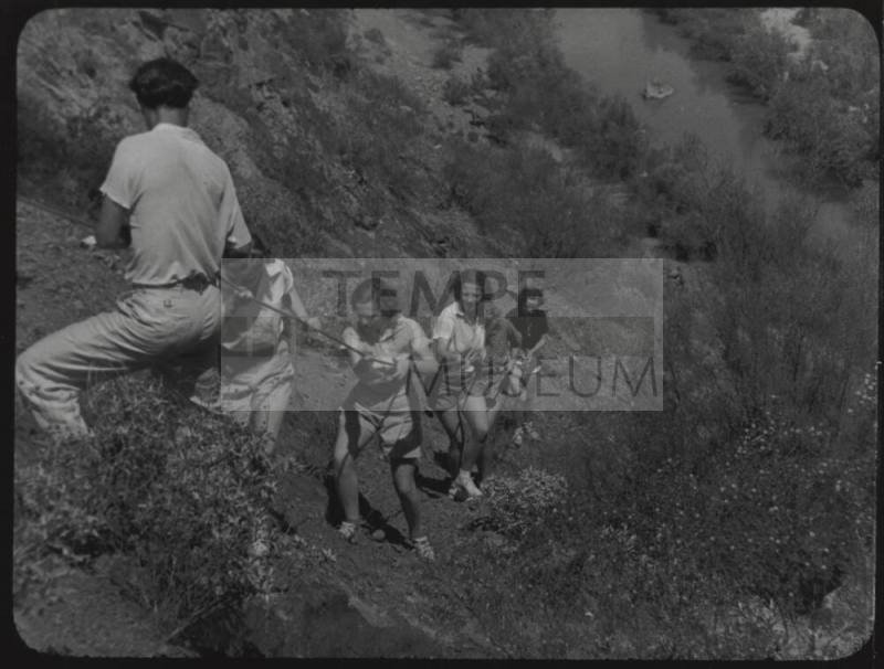 Black and white Photograph: group of coeds climbing Tempe Butte