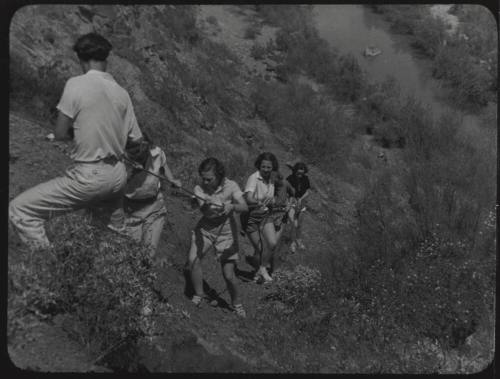 Black and white Photograph: group of coeds climbing Tempe Butte