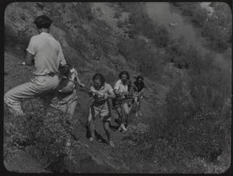 Black and white Photograph: group of coeds climbing Tempe Butte