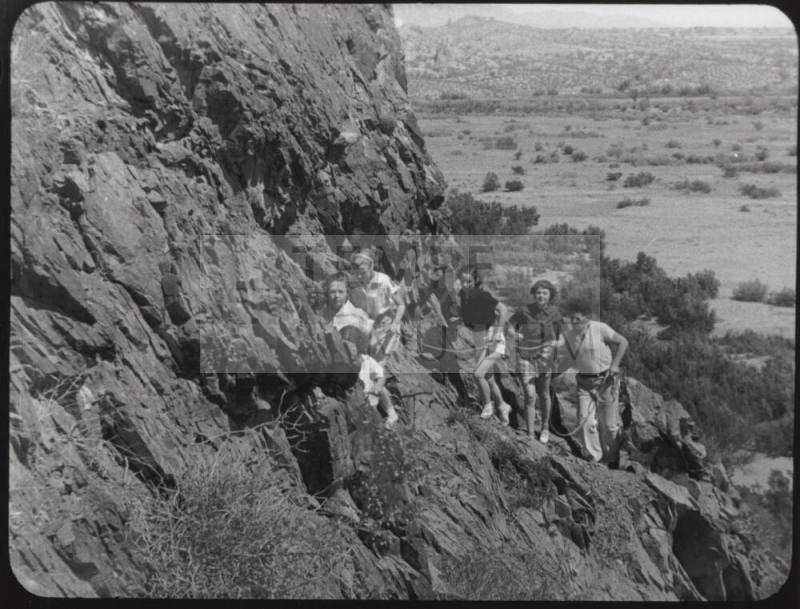 Black and white photograph: group of coeds climbing Tempe Butte