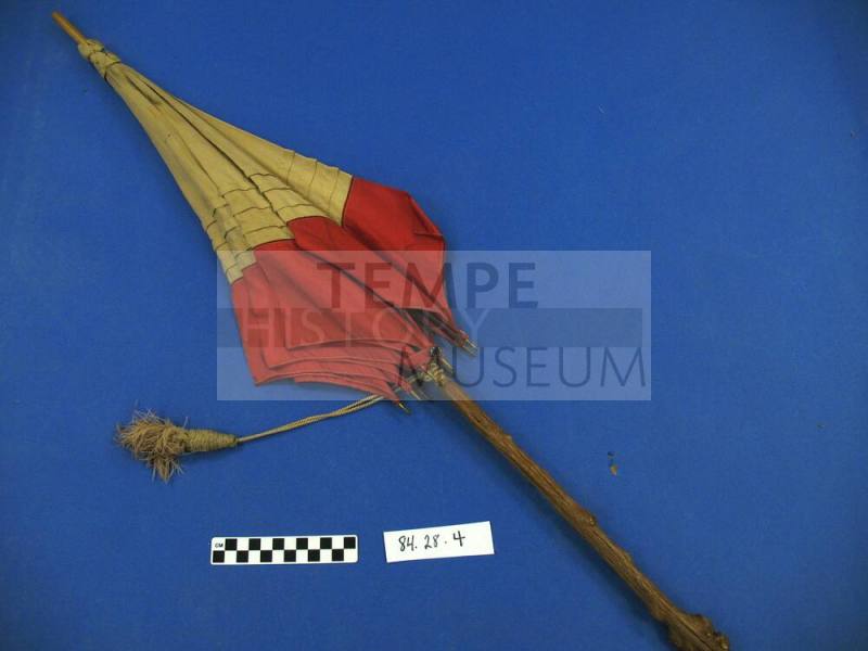 Red and tan silk parasol