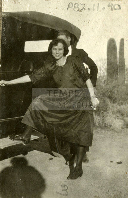KAYGEE photograph of woman near a car
