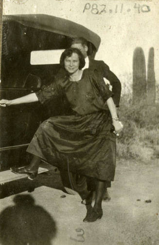 KAYGEE photograph of woman near a car