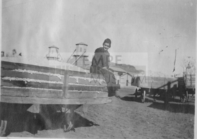 Girl on Wagon full of cotton