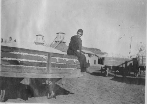 Girl on Wagon full of cotton