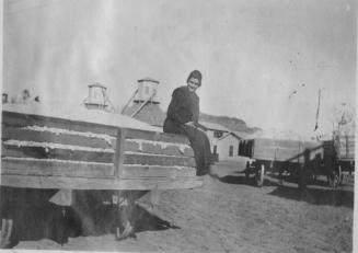 Girl on Wagon full of cotton