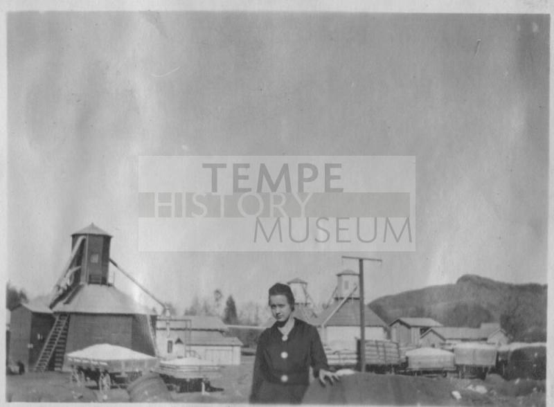 Girl standing behind cotton farm