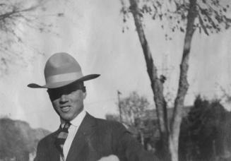 Man smiling wearing a hat