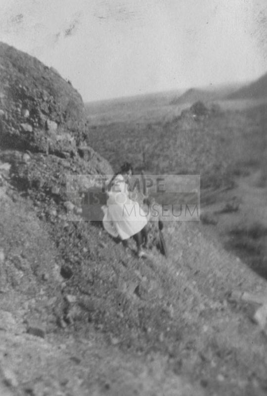 Velma on the side of a hill