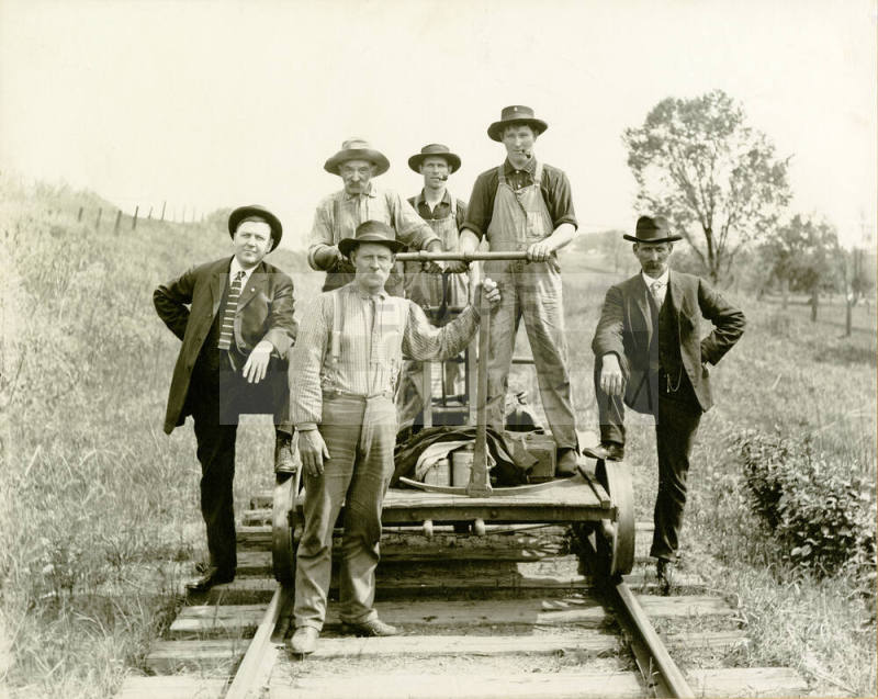 Railway track workers with Hand Car on track
