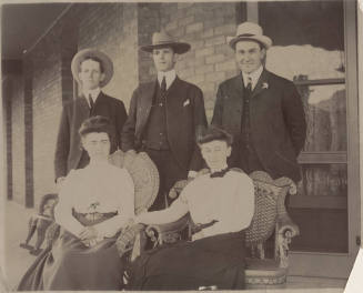 Group of Three Men Standing, Two Women Seated