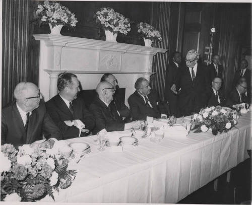 Senator Hayden and President Johnson, among others, seated at table