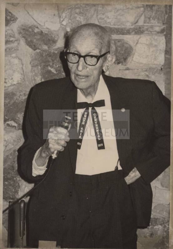 Carl Hayden with Microphone and Tempe Centennial Tie