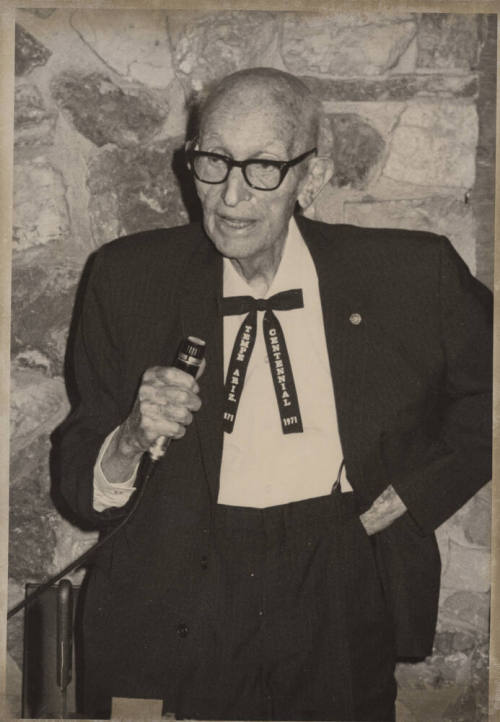 Carl Hayden with Microphone and Tempe Centennial Tie