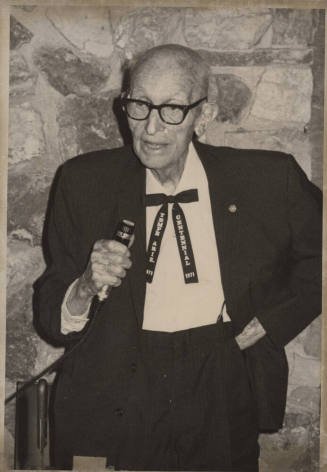 Carl Hayden with Microphone and Tempe Centennial Tie