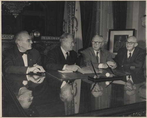 Four Men seated at Glass-Topped Desk, Hayden at Eight