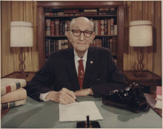 Senator Hayden seated behind office desk