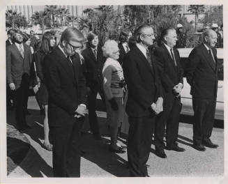 Group of People in Formal Attire Gathered