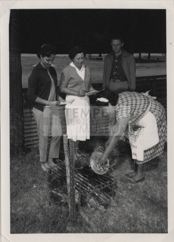 Four People Gathered on a Ranch